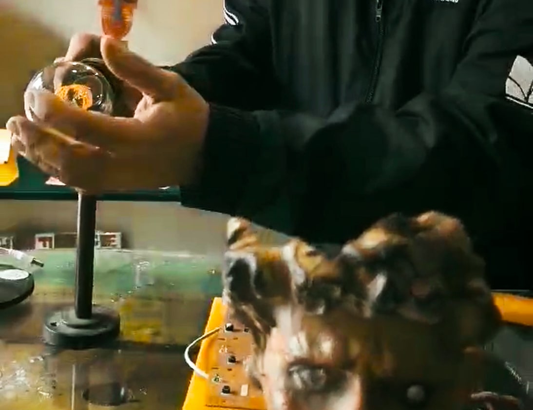 Close-up of the artist’s hands crafting a light sculpture at Big Idea Lamps studio in Gazi, Athens