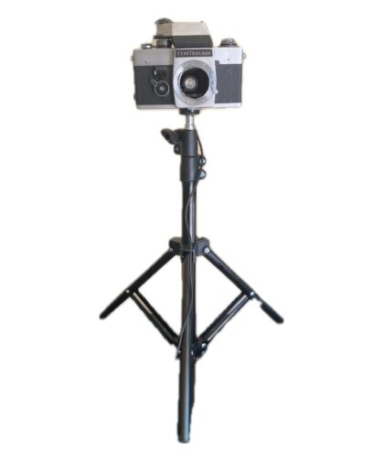 Floor lamp with adjustable tilt and height.