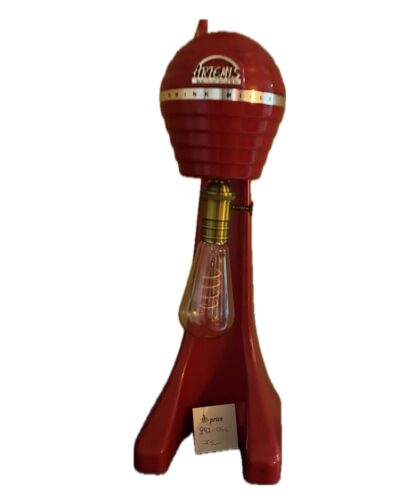 Old red frappé mixer with a vintage lamp.