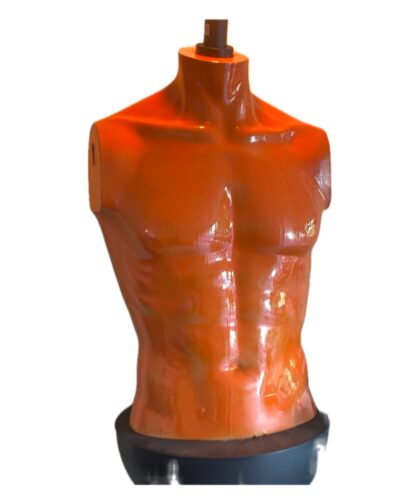 Orange doll torso with light.