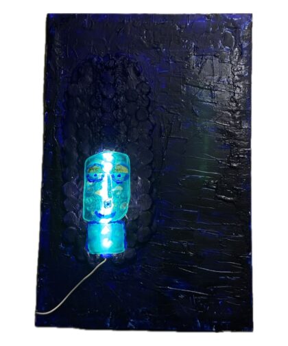 Wall-mounted structure with blue acrylics and a backlit sculpture.