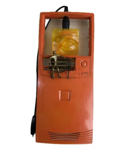 Computer case top with a resin sculpture and lighting.