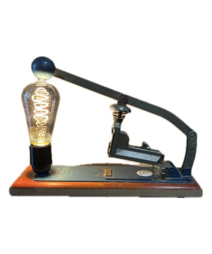 Metal cutting tool with a heart-shaped lamp and vintage cord.