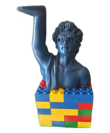 Lego base with a resin statue and torch-style lighting.